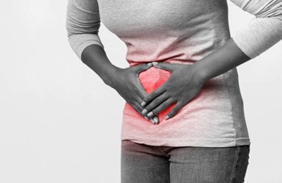 Syndrome Des Ovaires Polykystiques Gynecologycal problems. Cropped of afro woman rubbing her belly, having acute pain, monochrome, empty space