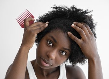 Front view woman holding pink brush 360x260